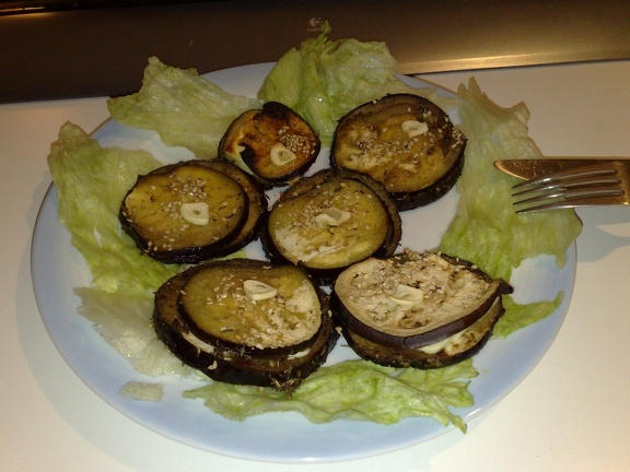 eggplant/aubergine with cheese and garlic on lettuce