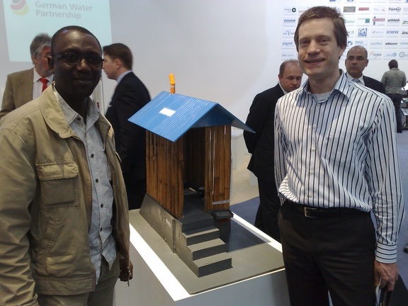 my colleagues Abdoulaye & Christian in front of the UDDT model from The Philippines