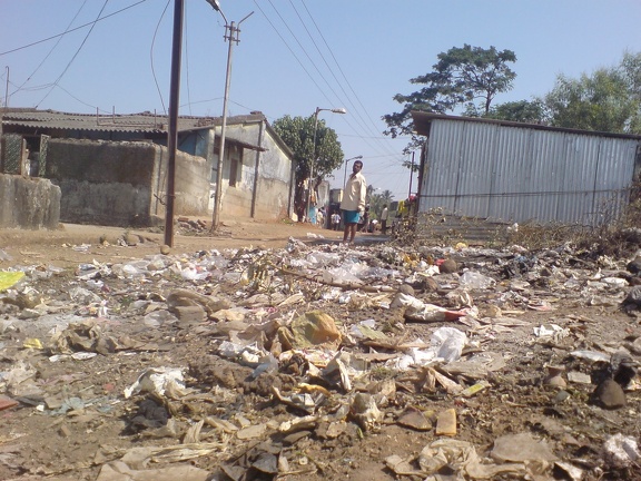 open dump of solid waste in slum